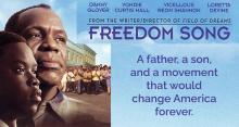 Close-up of Danny Glover as Will Walker and Vicellous Shannon as Owen Walker, with town and townspeople in background. Text says: "Freedom Song: A father, a son, and a movement that would change America forever."